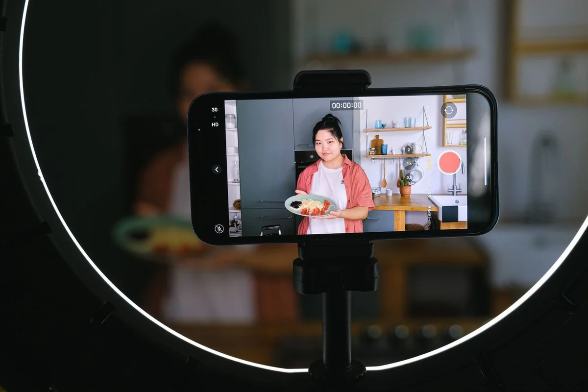 A smartphone and ring light set up for social-commerce content